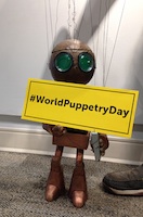 Robot Marionette with #WorldPuppetryDay hashtag Sign